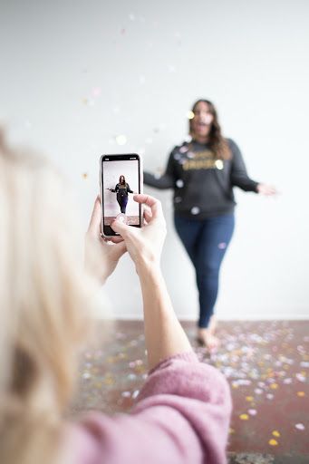 Girls-making-a-tiktok-video-with-confetti